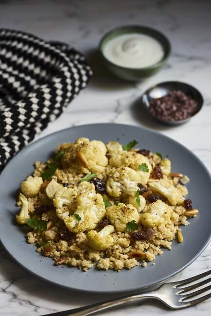 Cauliflower couscous with pine nuts — Stock Photo