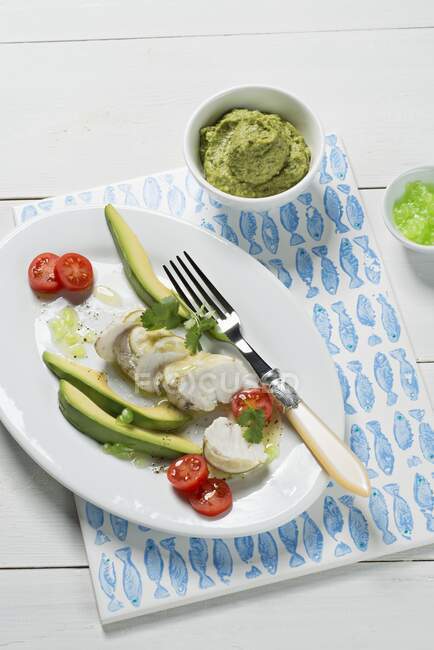 Monkfish fillet with lime, coriander and avocado dip — Stock Photo