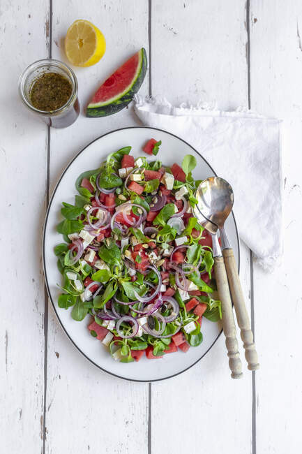 Watermelon salad with lamb's lettuce, feta, red onions and mint — Stock Photo