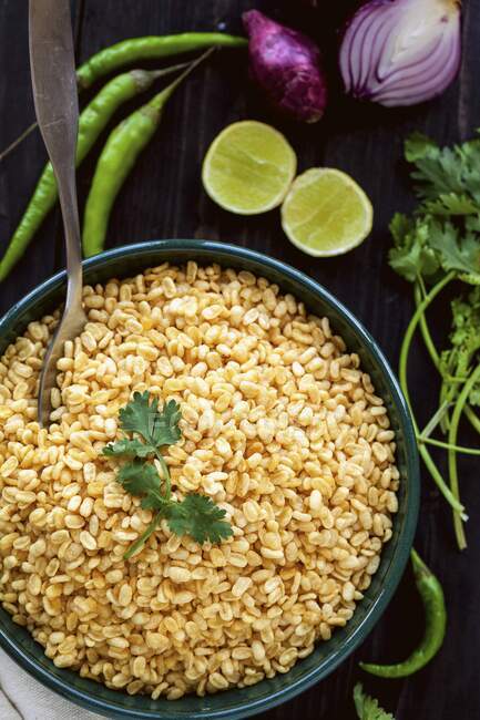 Salad ingredients: yellow mung beans, chillies, limes, coriander and red onions — Stock Photo