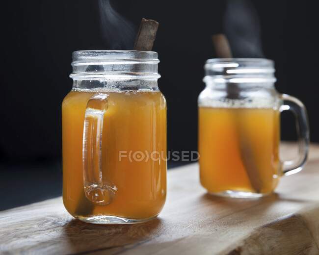 Mulled cider with a cinnamon stick — Stock Photo