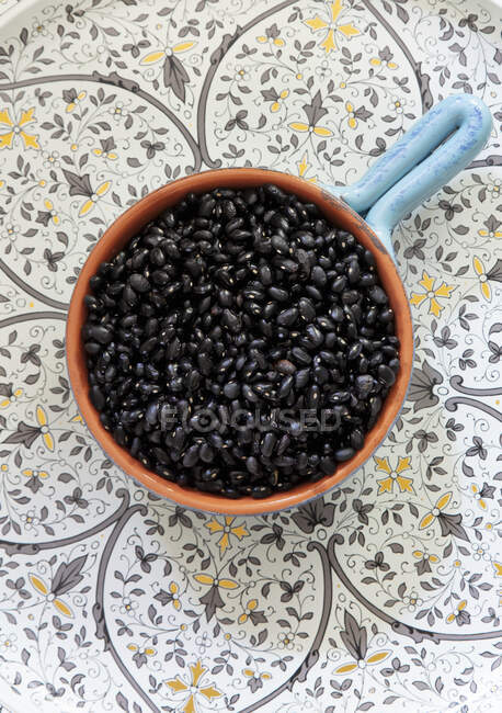 Black sesame seeds for cooking on a wooden background. top view. flat lay — Stock Photo