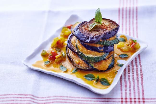 A ratatouille tower with pepper sauce — Stock Photo