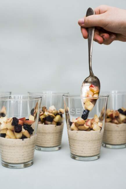 Cashew cream with fruit in glasses — Stock Photo
