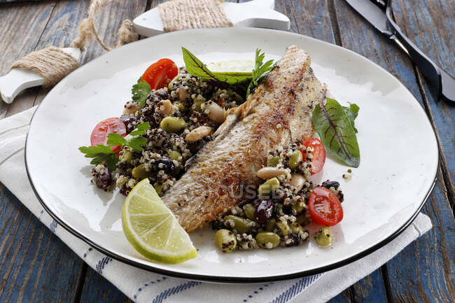 Fried mackerel with quinoa and beans — Stock Photo