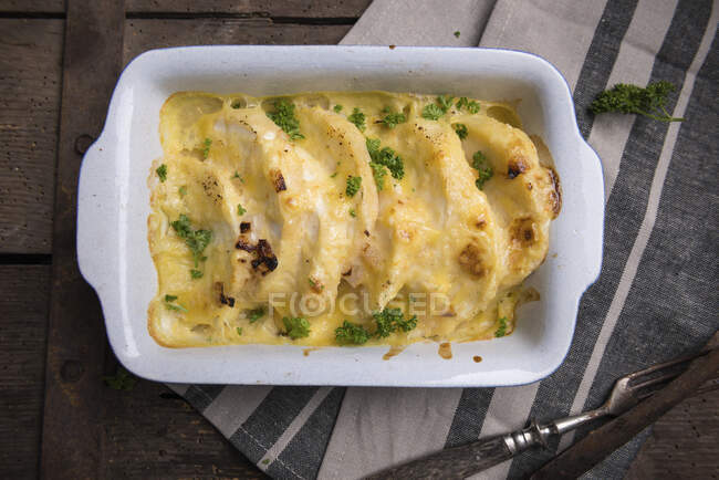 Celeriac gratin in a creamy cashew nut sauce topped with vegan cheese — Stock Photo