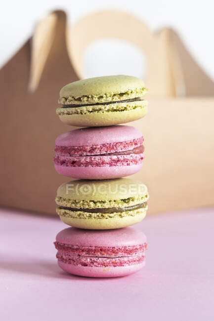 Pistachio and strawberry macarons stacked — Stock Photo