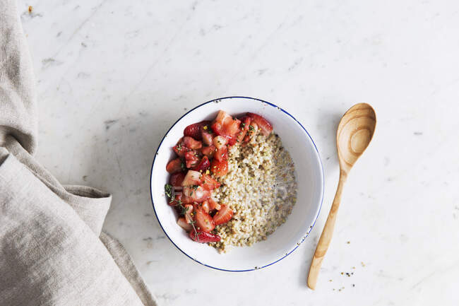 Buckwheat porridge with strawberry and thyme — Stock Photo