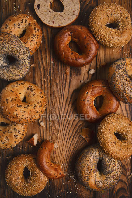 Multi flavored bagels on a wooden table — Stock Photo