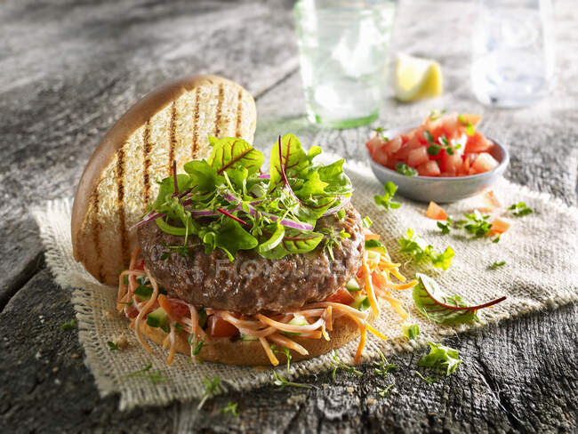Vegan burger with carrot coleslaw and baby chard — Stock Photo