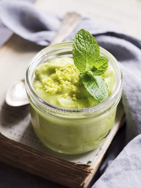 Vegan avocado mousse with lime in jar — Stock Photo