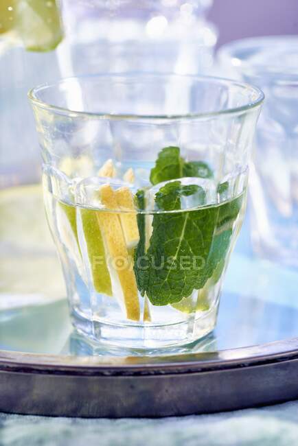 Lemonade drink with mint leaves in glass — Stock Photo