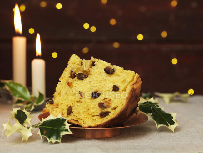 Christmas cake with candles and decorations on table. — Stock Photo