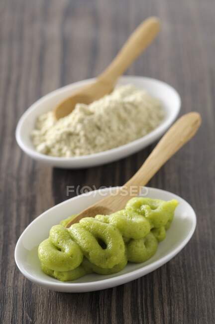 Wasabi with wooden spoons in small bowls — Stock Photo