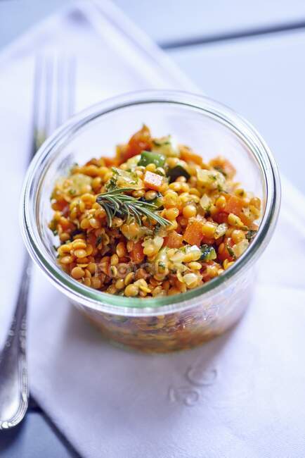 Red lentils salad in glass bowl — Stock Photo
