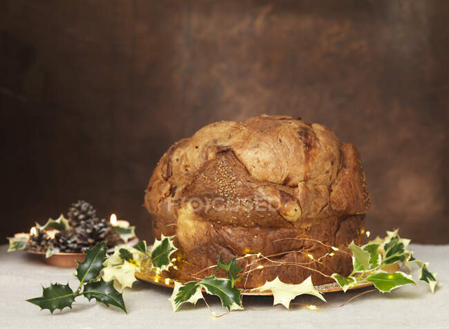 Baked bread with herbs and spices on a wooden background — Stock Photo