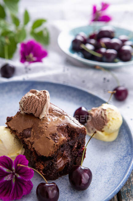 Chocolate and cherry brownies with ice cream — Stock Photo