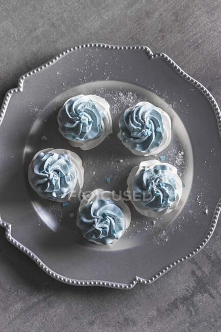 Meringue nests with pastel blue cream — Stock Photo