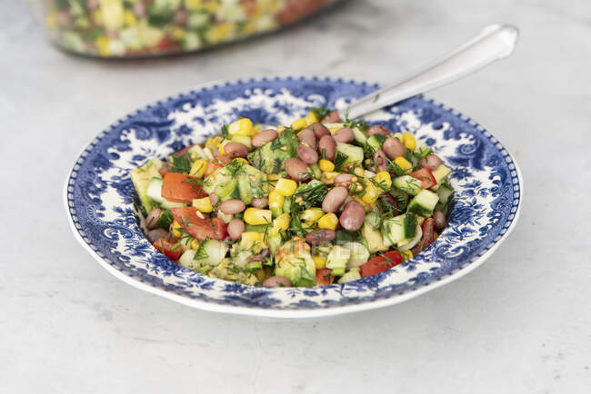 Red beans salad with corn, cucumber and tomatoes — Stock Photo