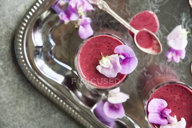 Vegan raspberry smoothie with almond milk on a silver tray — Stock Photo