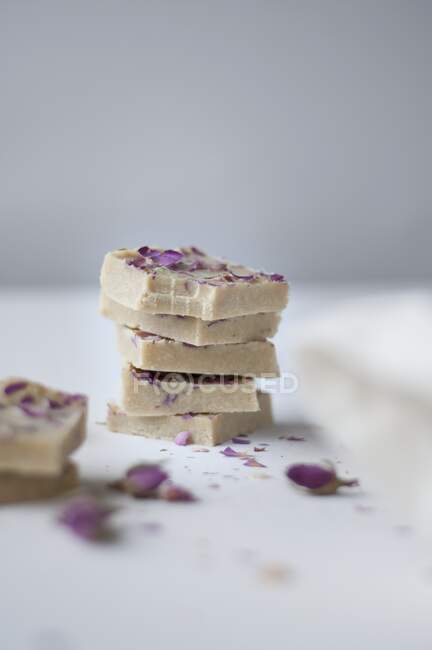 White chocolate with dried rose petals, cashew nuts, organic cocoa butter, honey, and vanilla — Stock Photo