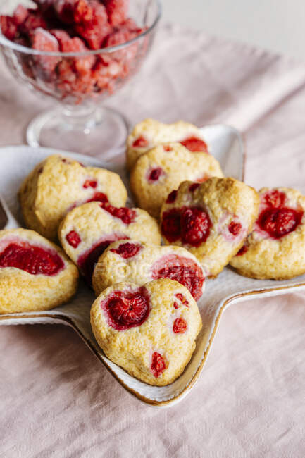 Heart shaped vanilla raspberry shortcakes — Stock Photo