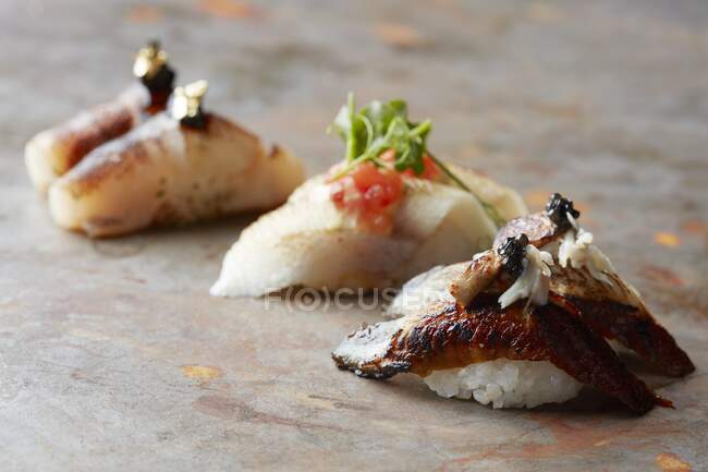 Close up shot of fresh sushi on rustic wooden table — Stock Photo