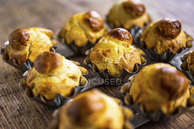Brioches in baking cases — Stock Photo