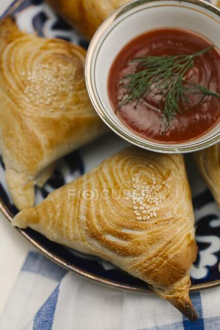 Pasties with a tomato dip — Stock Photo