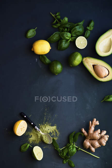 Green composition- avocado, basil, lemon and ginger — Stock Photo