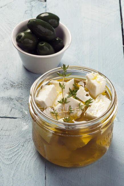 Feta cheese marinated in olive oil and herbs — Stock Photo