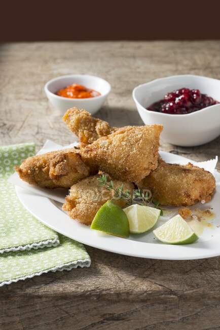 Fried chicken in a herb coating — Stock Photo