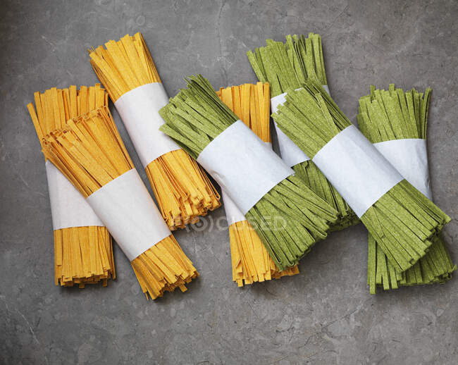 Dry pasta on grey background — Stock Photo