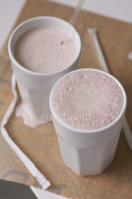 Two strawberry smoothies in glasses — Stock Photo