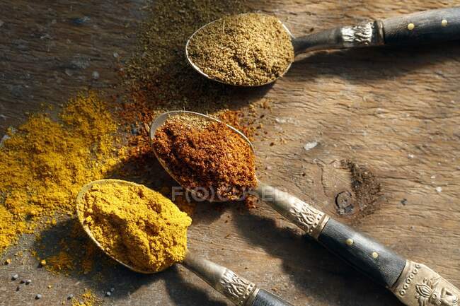 Various spices on oriental spoons — Stock Photo