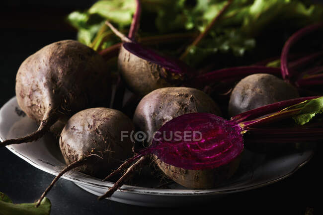 Fresh organic beetroot on black background — Stock Photo