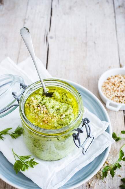 Zucchini pesto in a glass jar — Stock Photo