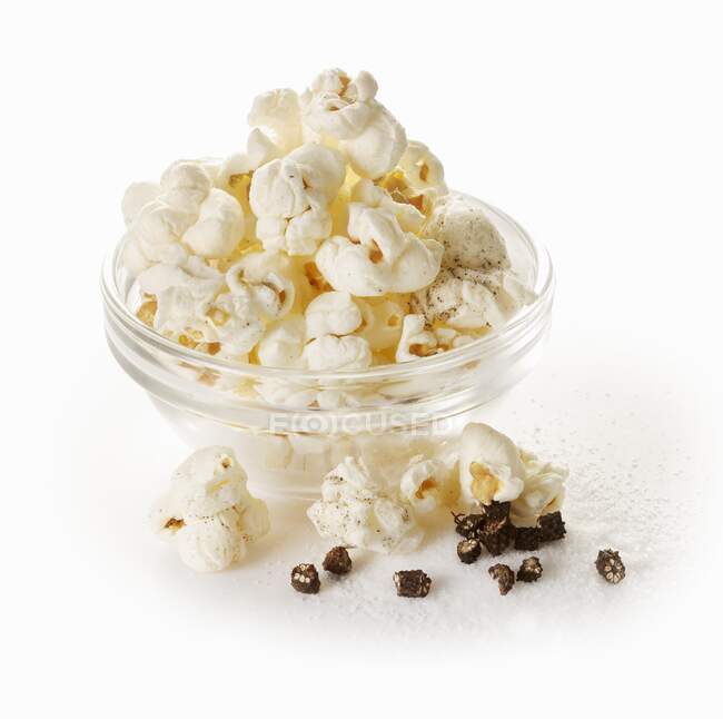 Popcorn with long pepper and salt — Stock Photo