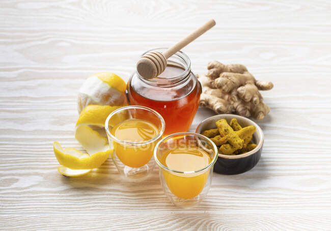 Homemade turmeric lemon ginger shots — Stock Photo
