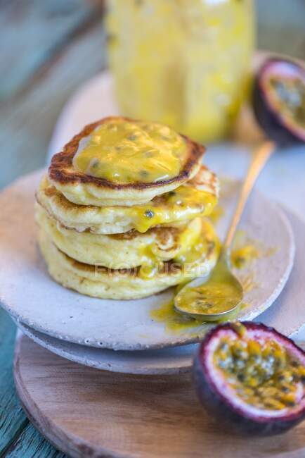 Pancakes with passion fruit spread — Stock Photo