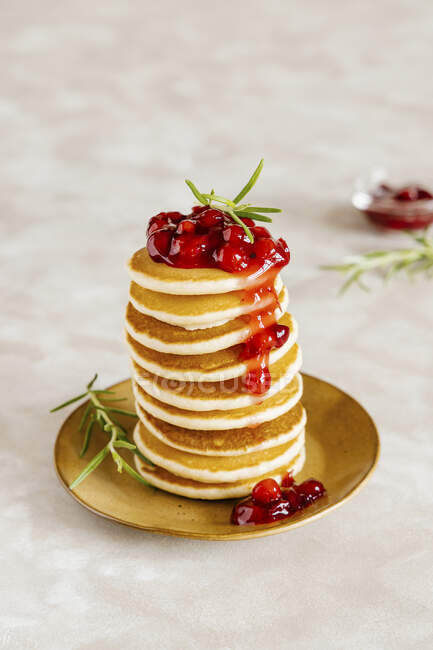Pancakes with canberry sauce — Stock Photo