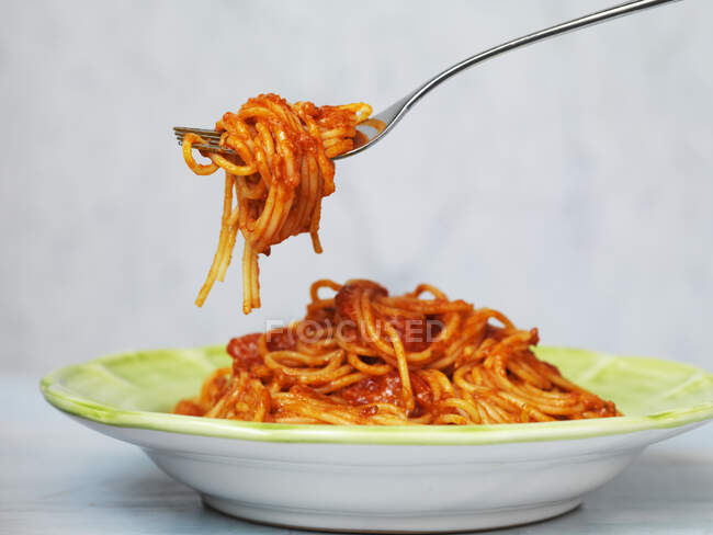Tomato pasta with spoon, closeup — Stock Photo
