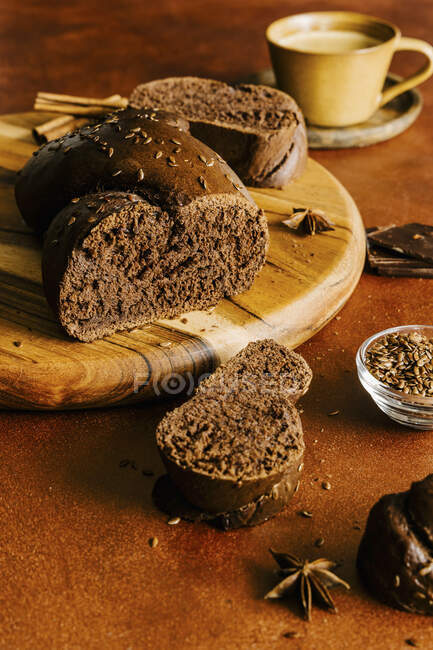 Chocolate brioche braided bread with flax seeds — Stock Photo