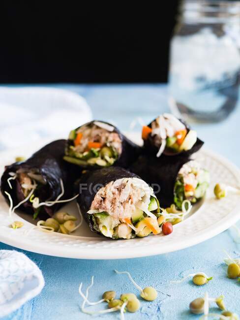 Nori wraps on a plate with shoots — Stock Photo