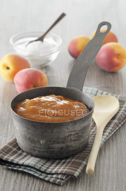 Apricot jam in the stewed pot — Stock Photo
