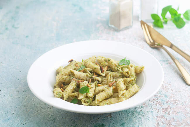 Penne with broccoli and mint pesto in plate — Stock Photo
