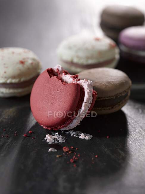 French macarons, with a bite taken out of one — Stock Photo