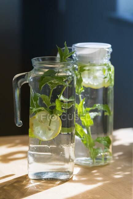 Elderflower water in glass jugs — Stock Photo