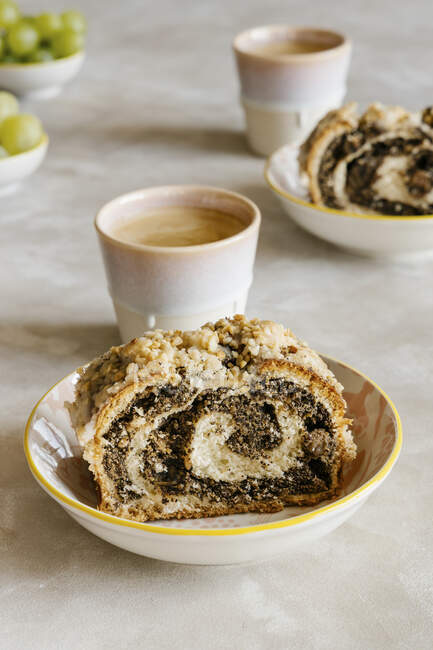 Traditional poppy seed roll and coffee — Stock Photo