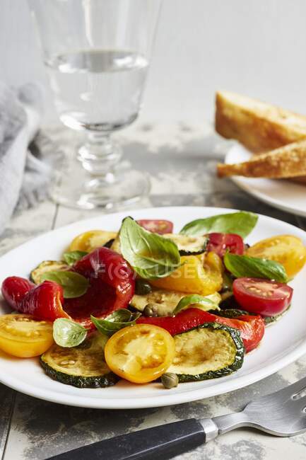Vegetable antipasti salad with basil — Stock Photo